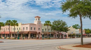 This is a bright, sunny daytime photo of Avon Park, showing a charming and quiet downtown street corner.