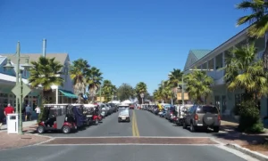 Image of a street running through The Villages, Florida on a bright sunny day.