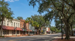 Yulee is a charming, sun-drenched photograph of a quiet main street in a historic small town, likely in the American South.